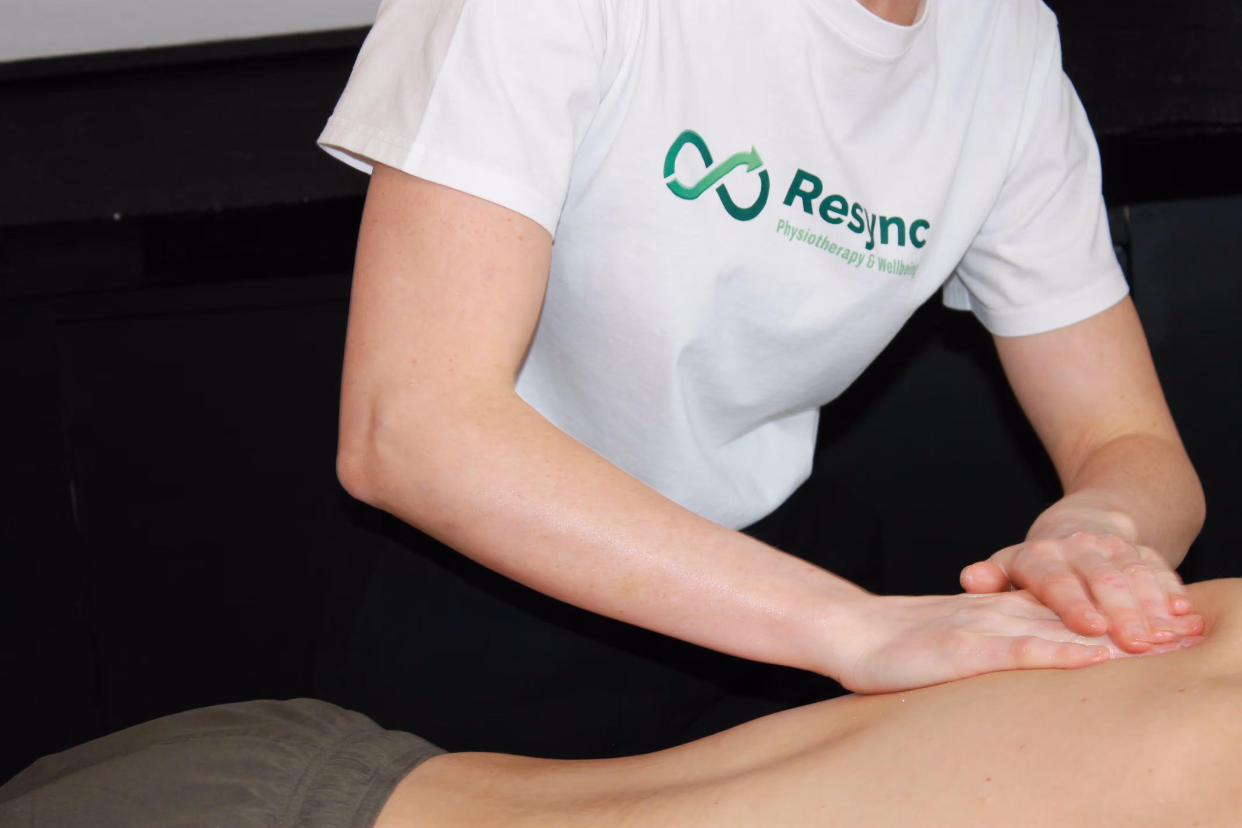 Active athlete recovering with sports massage therapy